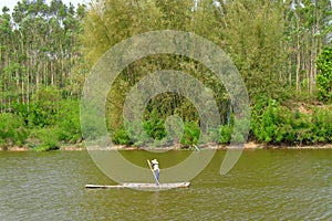 Carrying sugarcane by a bamboo raft