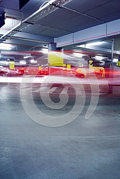 Cars in abstract underground parking garage