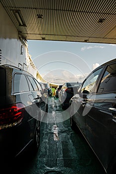 Cars being transported on one of the car ferry between Mortavika and ArsvÃÂ¥gen, Norway