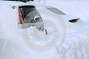Cars buried in snow