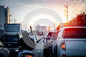 Cars on busy road in the city with traffic jam photo