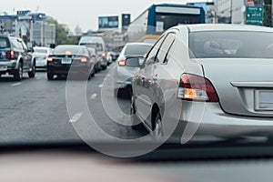 Cars on busy road in the city with traffic jam photo