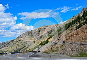 Cars carefully navigate the switchbacks to the summit of the Beartooth mountains.