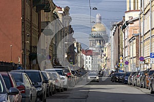 Cars on a city street, building, home, away Isaac`s Cathedral, P