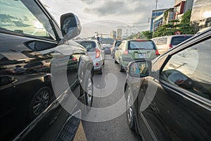 Cars on city street in traffic jam at rush hour