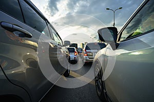 Cars on city street in traffic jam at rush hour