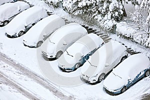 Cars covered with snow