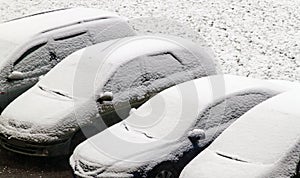 Cars covered with snow