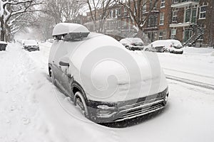 Cars covered with snow during snow storm