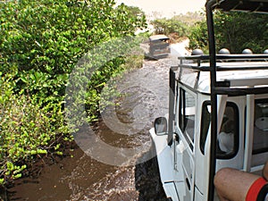 Cars crossing a river. Lencois Maranhenses. Brazil