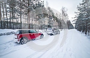 Cars on a difficult road, winter driving