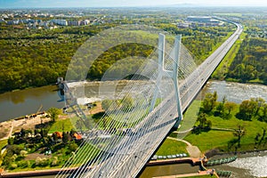 Cars drive on cable-stayed Redzinski Bridge over river