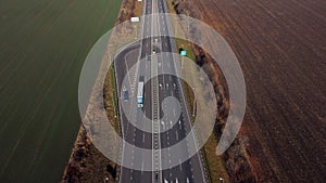 Cars driving along highway on autumn sunny day. Automobile road with markings