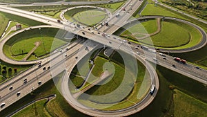 Cars are driving along a large roundabout, aerial view