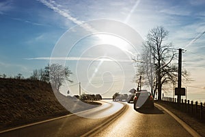 Cars driving down country road