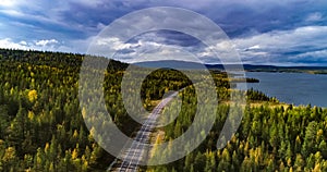 cars driving on a fall road Lapland