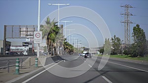 Cars driving on highway of Barcelona. Automobiles moving along city street