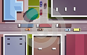 Cars driving road city streets with buildings top angle view horizontal