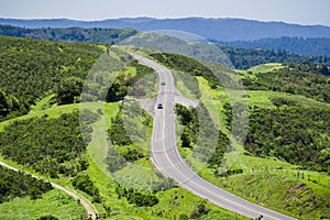 Cars driving on Skyline Boulevard on a spring day, San Francisco bay area, California