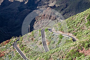Cars driving on TF-436 mountain zig-zag road in Macizo de Teno mountains, island Tenerife, Canary, Spain. Starts in Masca and fini