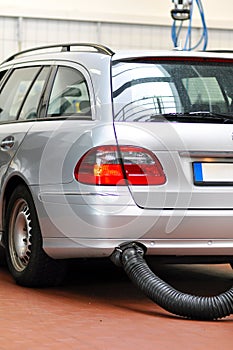 Cars for emission test in a garage