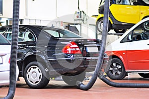 Cars for emission test in a garage