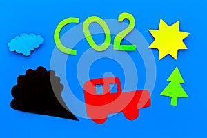 Cars emitting carbon dioxide. Pollution concept. harm the environment. Car and smoke cutout on blue background top view