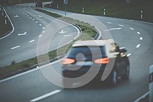 Cars on a highway at sunset