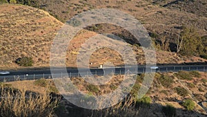 Cars on a hillside Highway