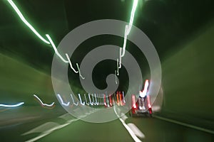 Cars inside the highway tunnel. Light trails effect.