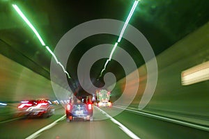 Cars inside the highway tunnel. Trails effect.