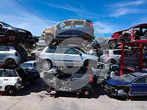 Cars in junkyard, pile for recycling