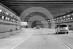 Cars passing through Lighted Tunnel