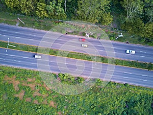 Cars moving in empty asphalt road