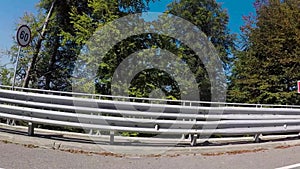 Cars moving on a highway road in summer landscape. Scene. A trip by car on the Sunny road. Mountainous area