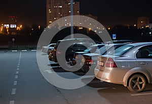 cars at night in parking