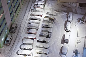 Cars on night winter parking lots