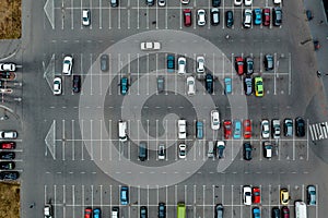 Cars are packed in the car park near the airport, aerial top view