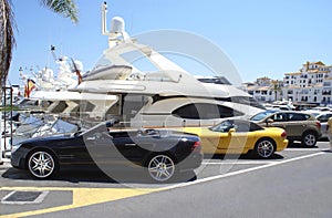 Cars parked in the car park of the Yacht Club of Marbella in Spain