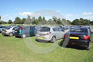 Cars parked in a field