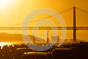 Cars Parked in Front of a Bridge at Sunset