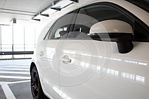 Cars parked in a garage with no people.