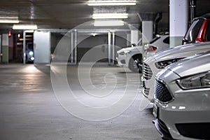 Cars parked in a garage with no people