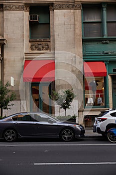 cars parked near vintage building with