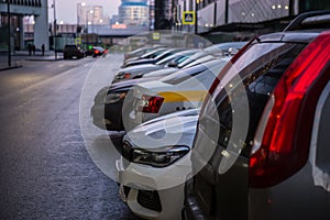 Cars Parked In A Row By The Mall