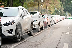 Cars parked on the urban street side