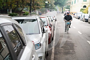 Cars parked on the urban street side