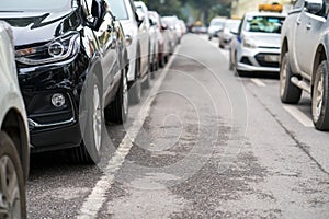 Cars parked on the urban street side