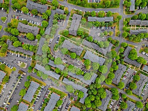 Cars parking on asphalt busy parking lot with Stay home during the Covid-19 coronavirus pandemic aerial view of residential