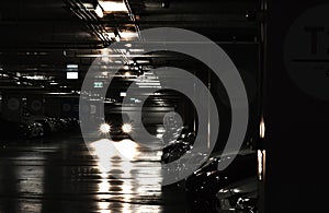 Cars parking in parking lot in dark